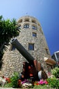 Moorish tower and canon in Puerto Banus port in spain Royalty Free Stock Photo