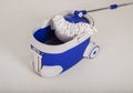 Mop and blue bucket for cleaning floor Royalty Free Stock Photo