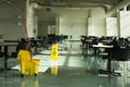 Mop bucket caution sign cafe tables Royalty Free Stock Photo