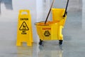 Mop, Bucket and Caution Wet Floor Royalty Free Stock Photo