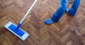 Mop cleaning a wooden floor