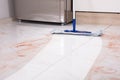 Mop In Kitchen Cleaning Dirty Floor