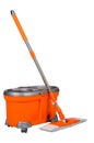 A mop and an orange bucket on a white isolated background Royalty Free Stock Photo