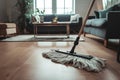 Mop resting on wooden floor in well maintained living room