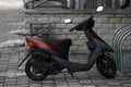 A moped on a cobblestone sidewalk Royalty Free Stock Photo