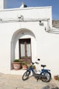 Moped parked in front of a trullo in Alberobello Ã¢â¬â Italy Royalty Free Stock Photo