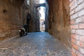 moped parked in narrow cobblestone alleyway in typical ancient Italian town