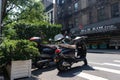 Mopeds Parked along the Street in Greenwich Village of New York City with a Bodega