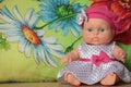 Moppet doll sitting on a flower