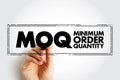 MOQ Minimum Order Quantity - fewest number of units required to be purchased at one time, stamp acronym text concept background