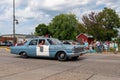 Parade in Mora, Minnesota for the Kanabec County Fair.Vintage baby blue police car.