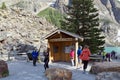 Moraine Lake, Alberta, Canada.  - June 6, 2018. Tourists on the shore of the famous glacial lake Moraine. Information about the Royalty Free Stock Photo