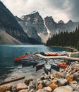 Moraine Lake and boat kayak canoe with mountains of Banff National Park in Canada