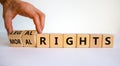 Moral or legal rights symbol. Businessman turns wooden cubes and changes words moral rights to legal rights on a beautiful white