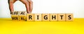 Moral or legal rights symbol. Businessman turns wooden cubes and changes words moral rights to legal rights on a beautiful white