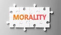 Morality complex like a puzzle - pictured as word Morality on a puzzle pieces to show that Morality can be difficult and needs