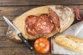 Morcon, a Spanish sausage with bread and tomato