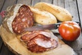 Morcon, a Spanish sausage with bread and tomato