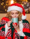 More coffee. happy new year. Christmas. Cheerful woman feel cosy.. Time to celebrate. girl santa hat milk cup. xmas mood Royalty Free Stock Photo