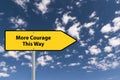 more courage this way traffic sign on blue sky Royalty Free Stock Photo