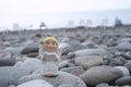 More creative idea Angel sing a song on pebble stone at black sea Batumi city for inspiration and background Royalty Free Stock Photo