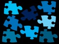 More piece of jigsaw earth tone color on black screen Royalty Free Stock Photo
