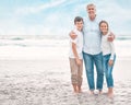 More than we bargained for. a mature man and his grandchildren bonding at the beach.