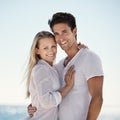 More than just a summer romance...A happy young couple embracing on the beach. Royalty Free Stock Photo