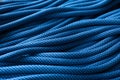 More than needed. Isolated photo of climbing knots. Top view of blue colored cables