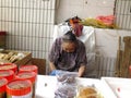 The more than and 90 year old Chinese old lady, sale of goods in the market