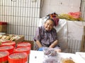 The more than and 90 year old Chinese old lady, sale of goods in the market