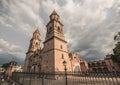 Morelia Cathedral, Michoacan, Mexico, at sunset, with rain clouds approaching Royalty Free Stock Photo