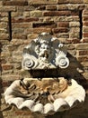 Moresco town in Fermo province, Marche region, Italy. Fountain, medieval wall and grotesque marque Royalty Free Stock Photo