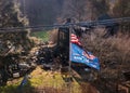 Trump 2024 flag in front of burned out home as metaphor for campaign Royalty Free Stock Photo