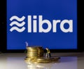 Golden coins on top of tablet computer for Libra cybercurrency Royalty Free Stock Photo