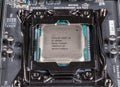 Macro image of Intel Core i9 CPU chip installed on modern motherboard