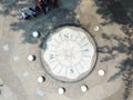 Aerial view of People standing infront of giant compass rose at Morib beach in