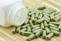 Moringa capsule pills with medicine bottles Royalty Free Stock Photo