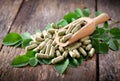 Moringa leaves and capsules Royalty Free Stock Photo