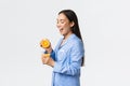 Morning, active and healthy lifestyle and home concept. Profile of excited happy asian girl in pajamas smiling while Royalty Free Stock Photo