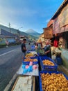 Morning atmosphere at the Kejajar Wonosobo traditional market. Traditional market with Mount Sindoro in the background