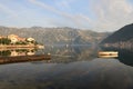 Morning in the Bay of Kotor. Boat and picturesque village