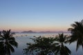 Morning on beach with trees and boats. Sunrise in Palawan island, Philippines. Tropical isles in morning dusk. Royalty Free Stock Photo