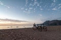 Morning on the beach in the village of Cirali, bicycles stand on the beach. Boats and ships in the distance of the Royalty Free Stock Photo