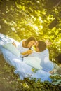 Morning on bed at nature. Young couple. Royalty Free Stock Photo