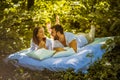 Morning on bed at nature. Young couple. Royalty Free Stock Photo