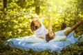 Morning on bed at nature. Young couple. Royalty Free Stock Photo