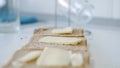 Morning Breakfast with Butter on the Toast, Spreading Margarine on a Fresh Slice of Bread in the Kitchen Royalty Free Stock Photo