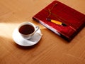 Morning breakfast coffe with vintage red notebook