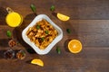 Morning breakfast, corn flakes, raisins, almonds, orange juice, top view, on a dark wooden background, flat lay. The concept of Royalty Free Stock Photo